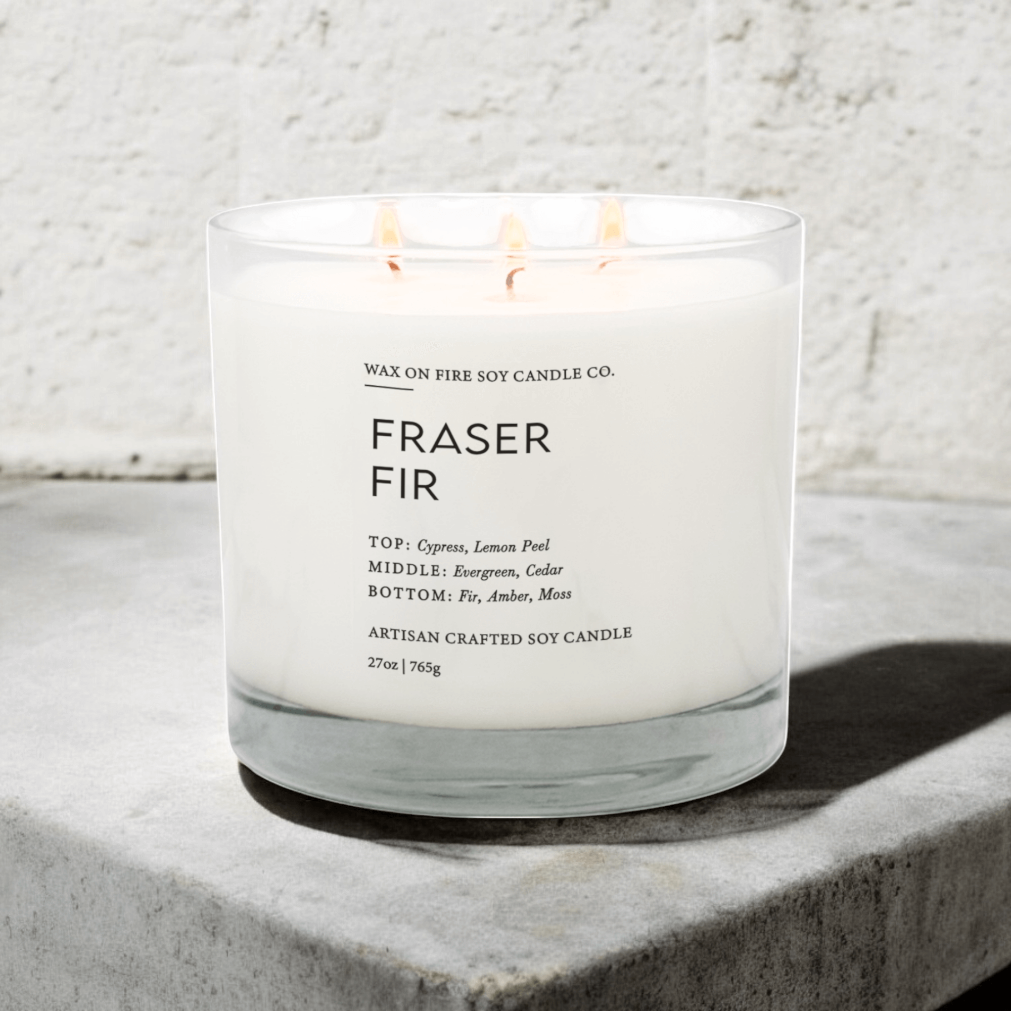 Fraser Fir Signature Luxe 3-Wick Candle with cypress, lemon peel, and evergreen scent blend, perfect for the holiday season.