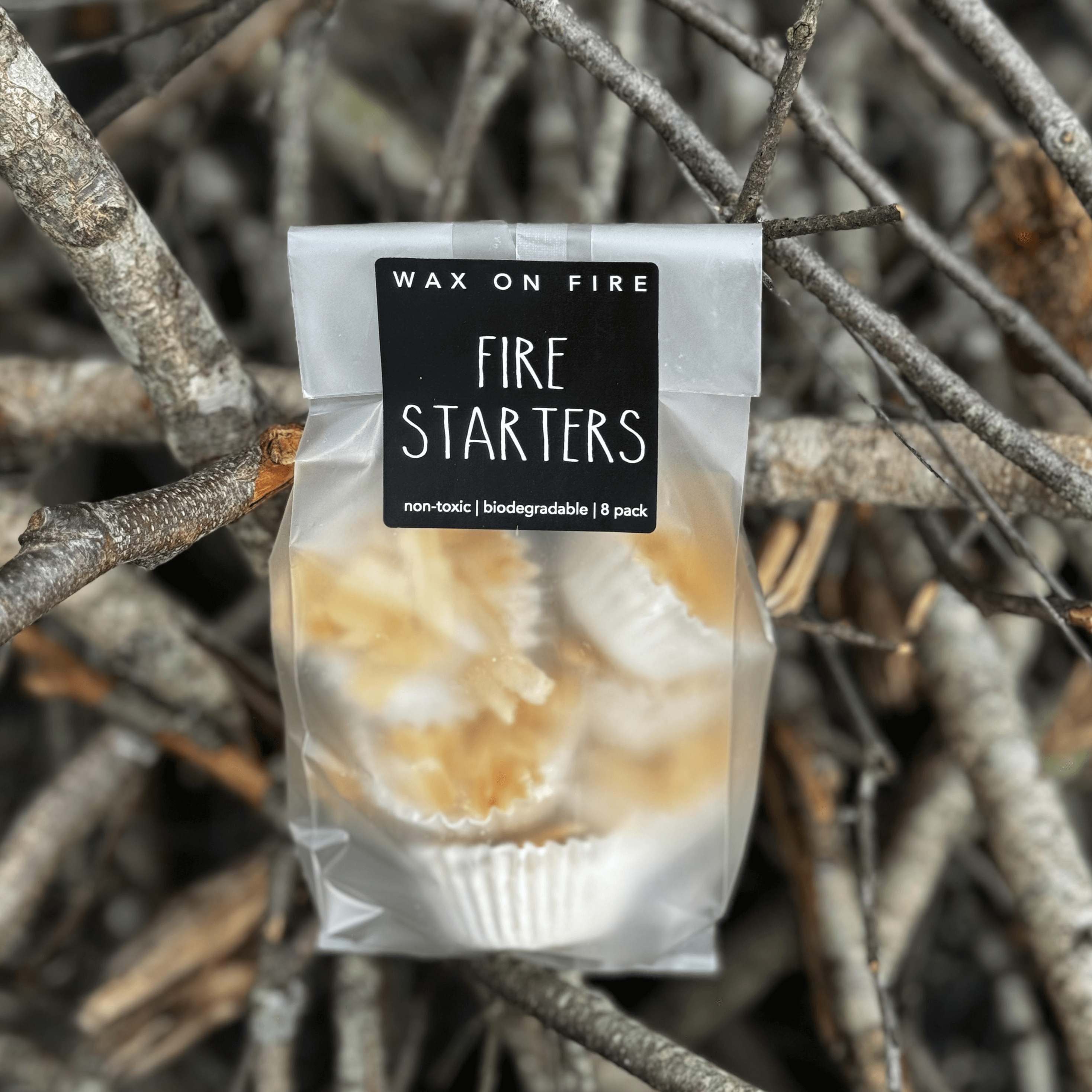 Eco-friendly fire starters in packaging, non-toxic and biodegradable, ideal for camping and home use.