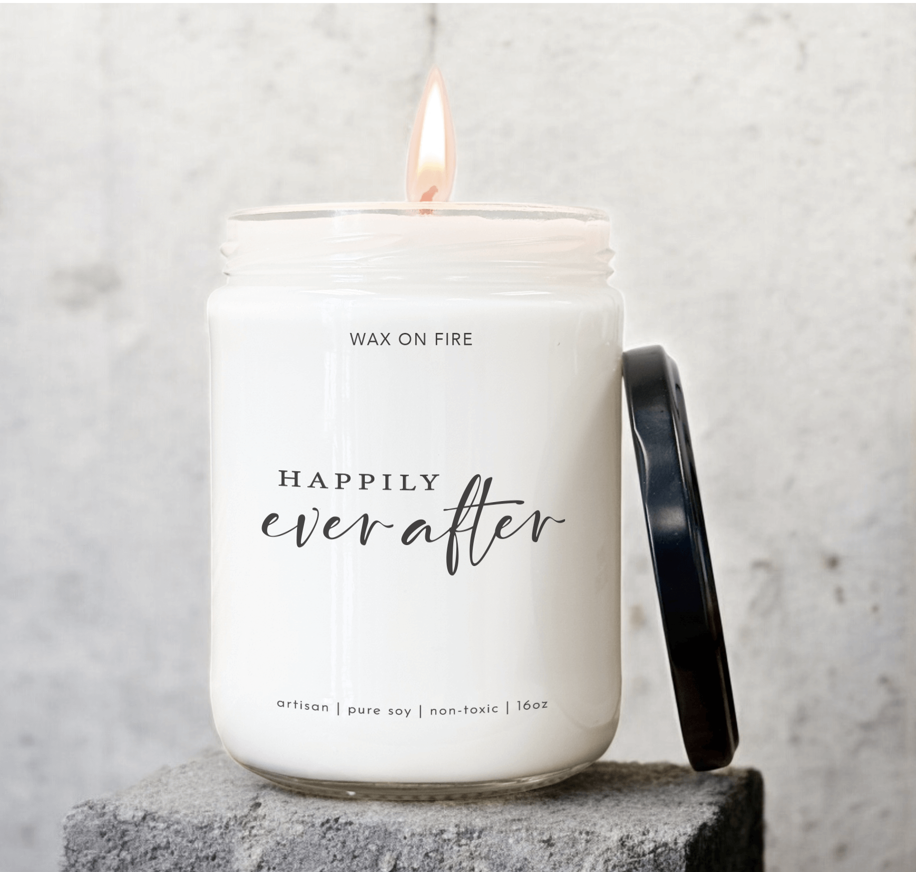 Happily Ever After candle in glass jar with flame, hand-poured, non-toxic soy wax, ideal for gifts and ambiance.