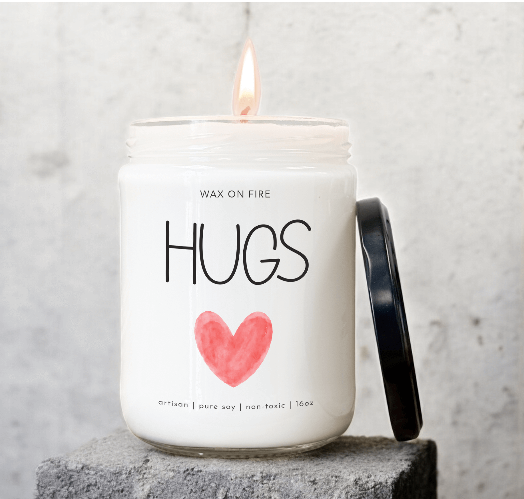 Hand-poured soy candle 'Hugs' with a heart design, non-toxic, 16oz, perfect for creating warmth and ambiance.