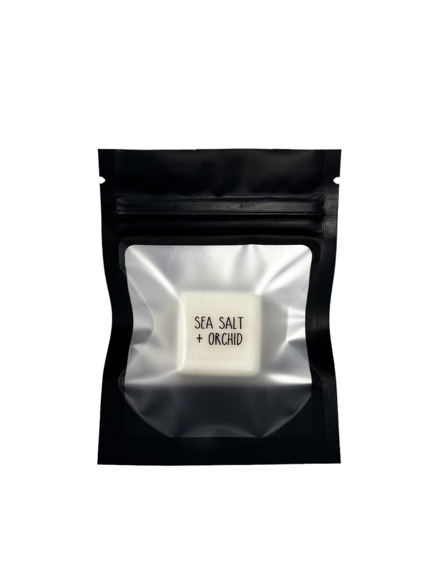 Scent sample of Sea Salt + Orchid in a black resealable pack, perfect for testing new wax melt fragrances.
