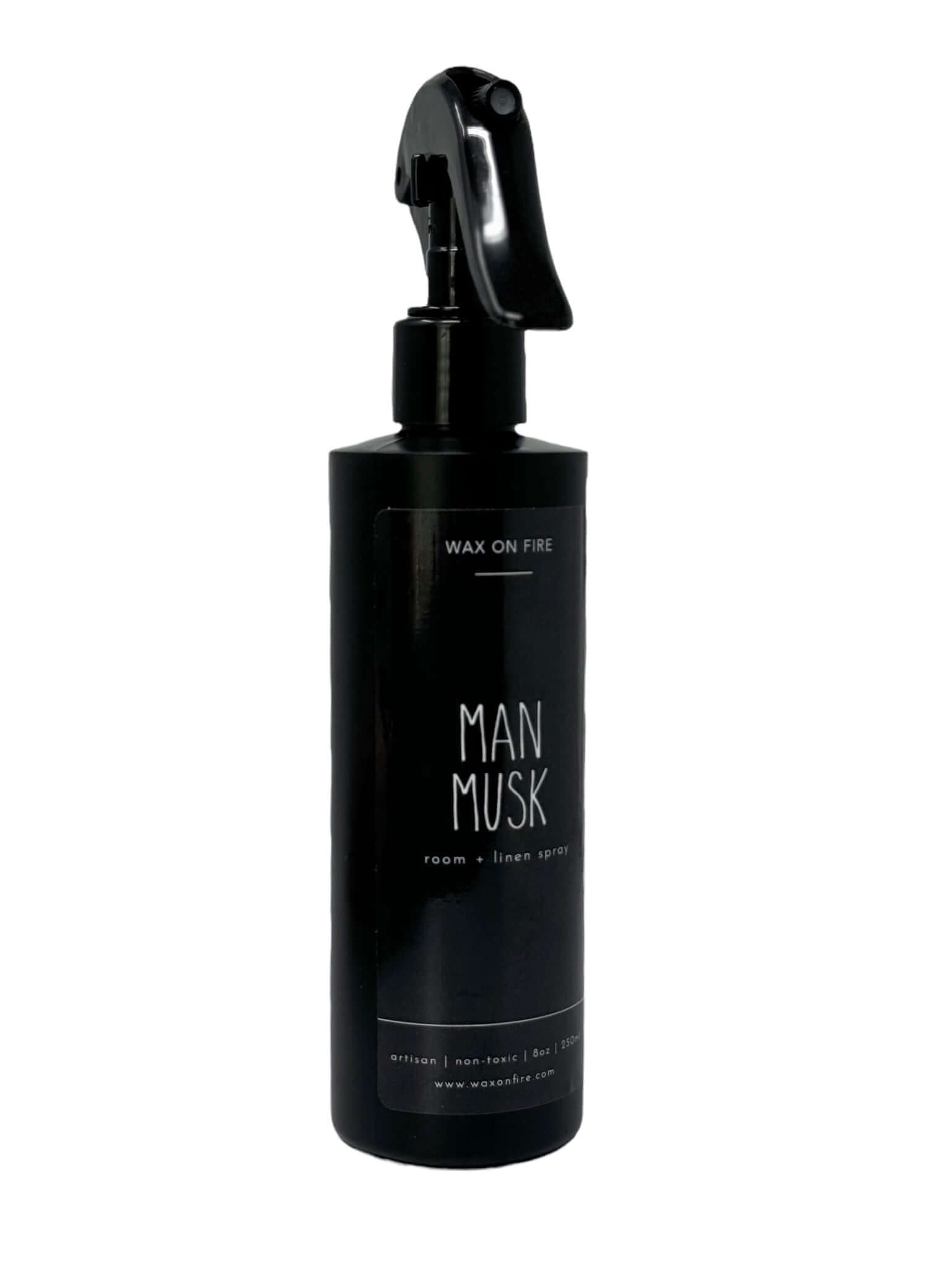 Room and linen spray in a sleek black bottle labeled 'Man Musk', promoting a natural and eco-friendly scent experience.