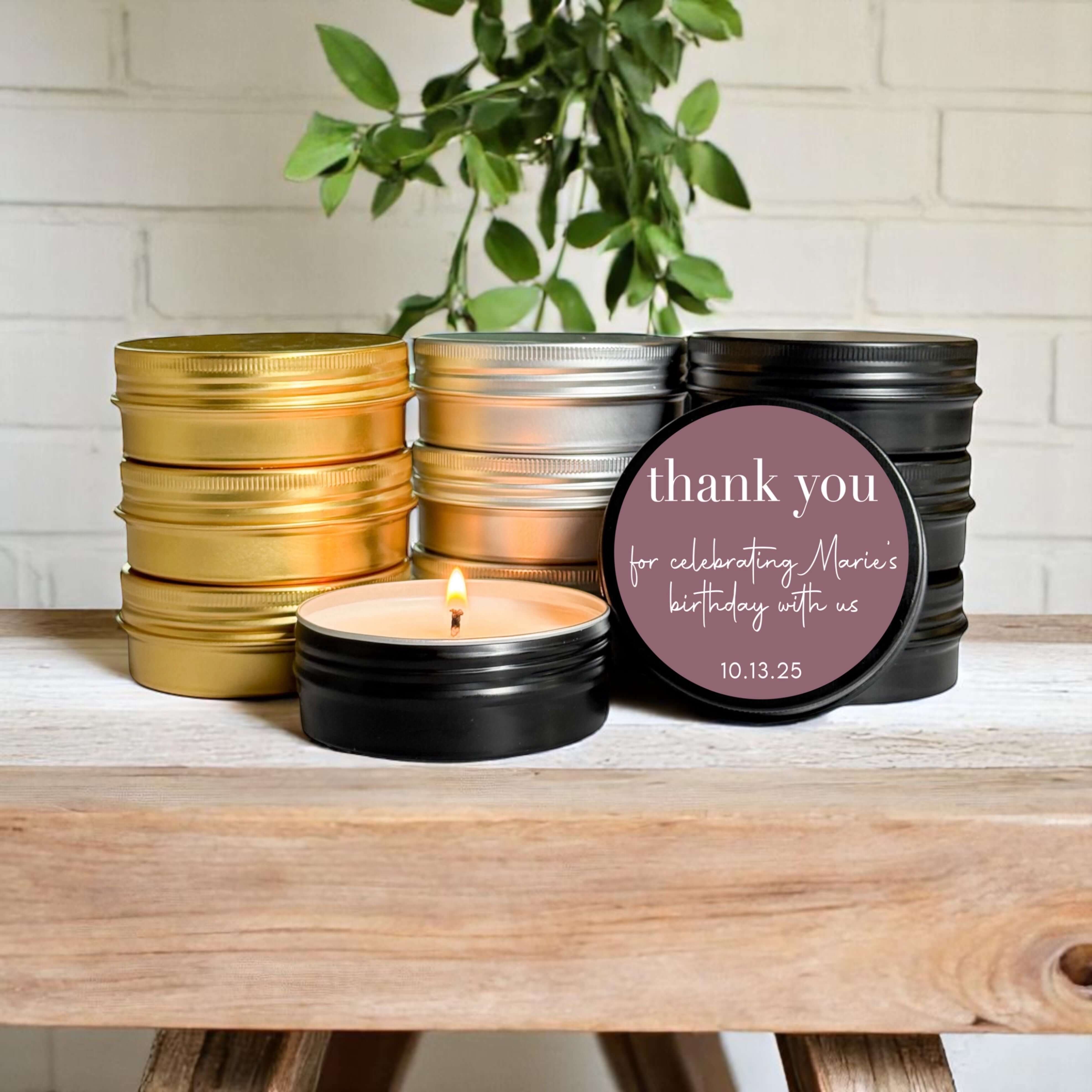 Collection of bulk birthday favor candles in stylish tins, featuring customizable labels and clean-burning soy wax.