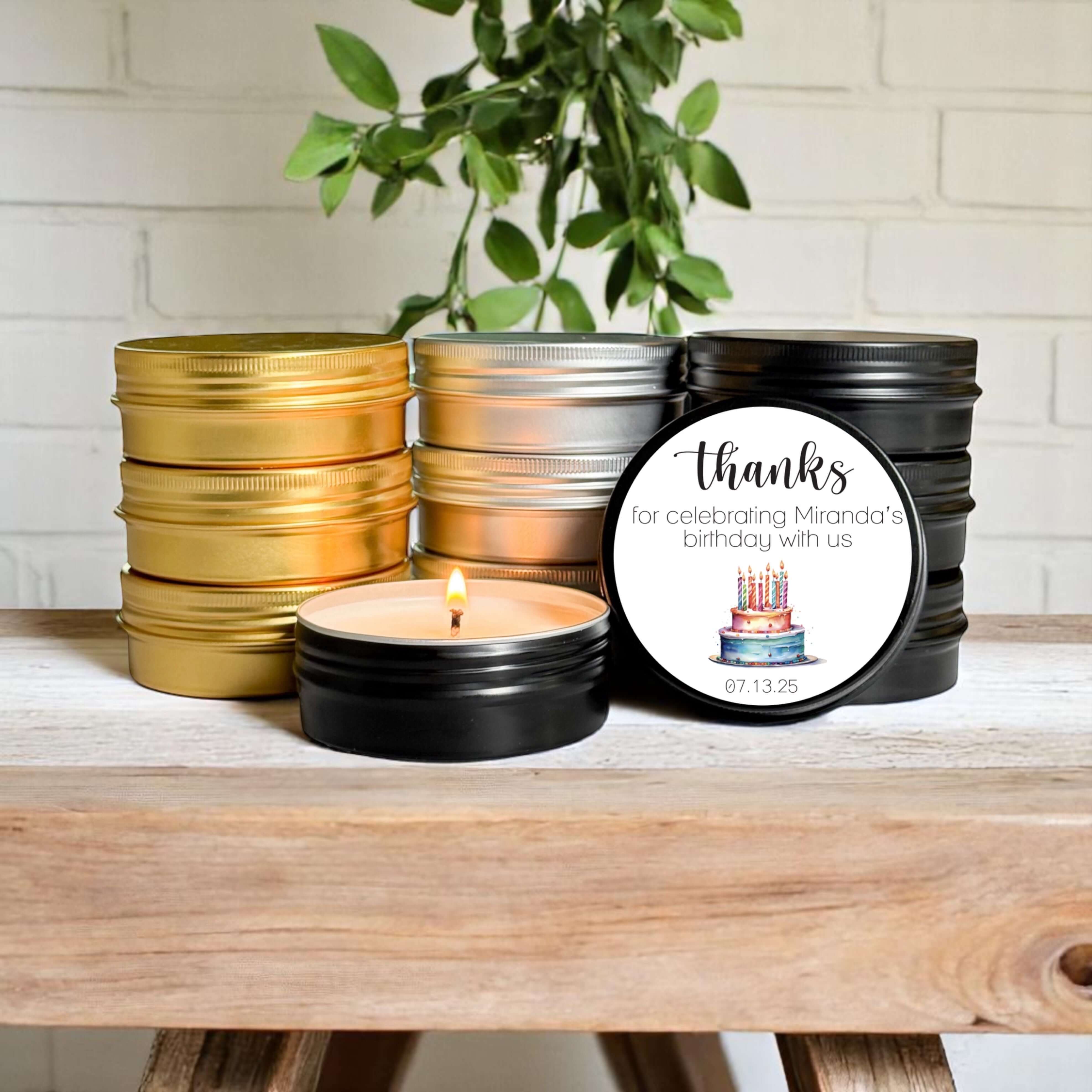 Bulk birthday favors with colorful tins and personalized candle for celebrations, featuring a 'Thanks' label.
